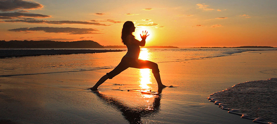 Warrior I at sunrise on the beach.